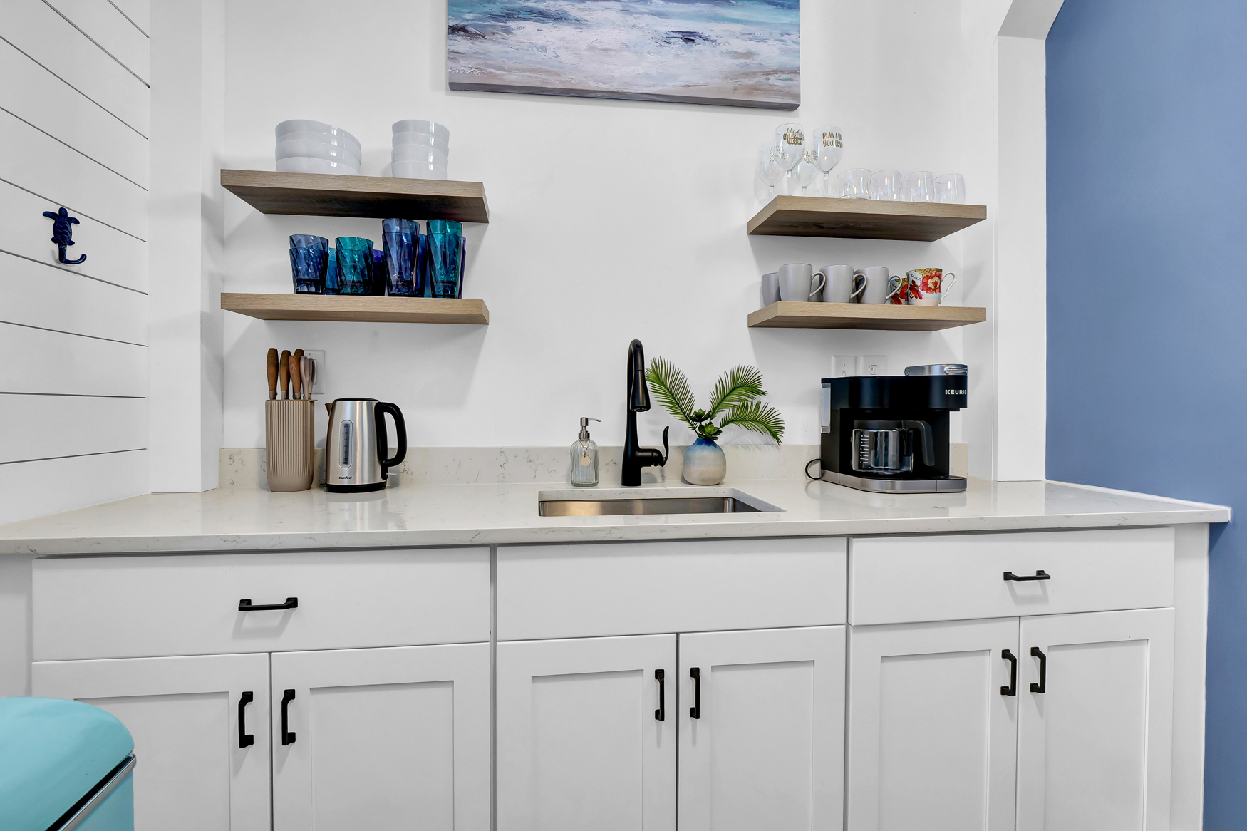 Sand Before Time kitchenette with coffee maker and compact dining area