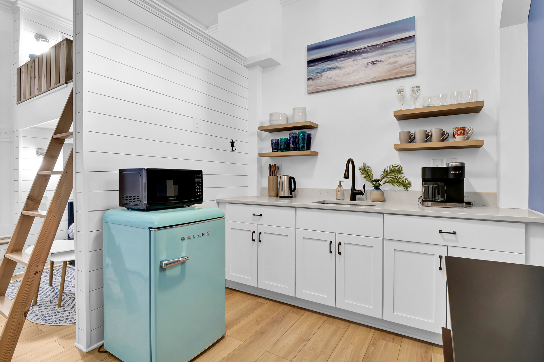 Compact kitchenette layout with mini fridge and microwave