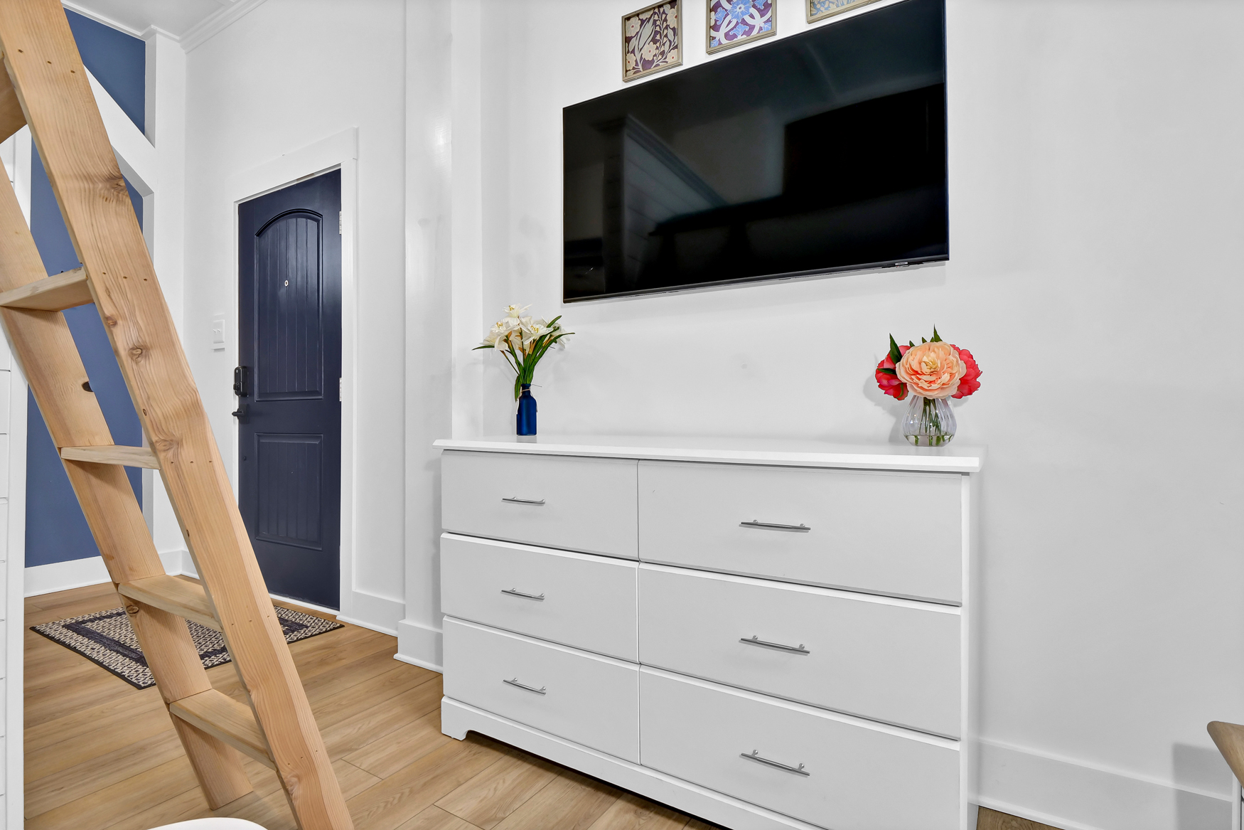 Smart TV and storage area in the studio living space